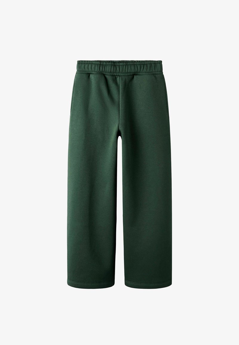 Grüne, weit geschnittene Sweatpants aus weichem Material. Mit einem elastischen Bund und ohne sichtbare Taschen, entworfen für Komfort und einfache Trageweise.