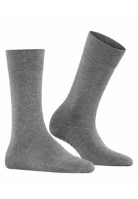 Chaussettes en coton gris avec une texture lisse, de longueur mi-mollet, et un bord côtelé. Conçues pour le confort avec un talon et une pointe renforcés.