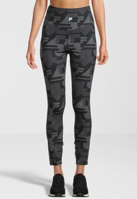Leggings neri con un motivo geometrico grigio, vita alta, tessuto elastico e un design elegante e aderente. Adatti per abbigliamento sportivo.