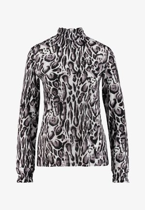 Top s dlouhým rukávem a rolákem s nepravidelným zvířecím vzorem v černé, šedé a bílé barvě na lehké látce.