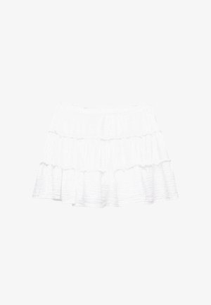 White tiered skirt made of lightweight, textured fabric. Features three ruffled layers and an elastic waistband.