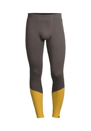 Lange leggings lavet af et struktureret stof, med en mørkegrå krop og lysende gule underben, i en tætsiddende design med forstærkede sømme.