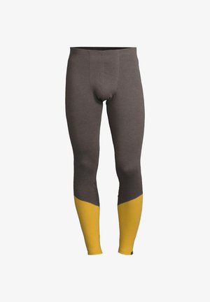 Lange leggings lavet af et struktureret stof, med en mørkegrå krop og lysende gule underben, i en tætsiddende design med forstærkede sømme.