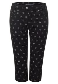 Svarta först pantalonger med ett vitt bladmönster, med knappstängning och fickor. Tillverkade av ett mjukt, slätt tyg.