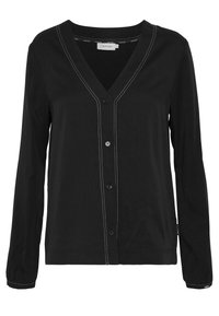 Cardigan nero in tessuto morbido con maniche lunghe, scollatura a V, chiusura centrale a bottoni e cuciture bianche a contrasto lungo i bordi.