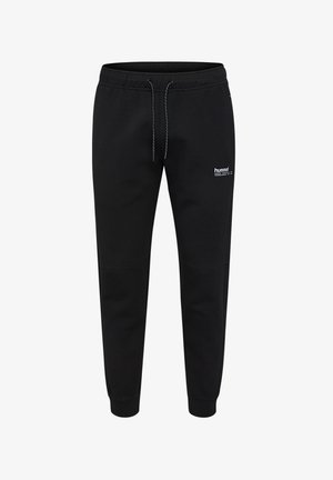 Pantalon de jogging noir en tissu doux. Il dispose d'une taille élastique avec cordon de serrage, de poches latérales et d'un petit logo sur la cuisse.