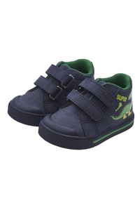 Sneaker in tela navy con doppie chiusure a Velcro, dettagli verdi e grafica di un dinosauro. Suola in gomma con grip testurizzato e colletto imbottito.