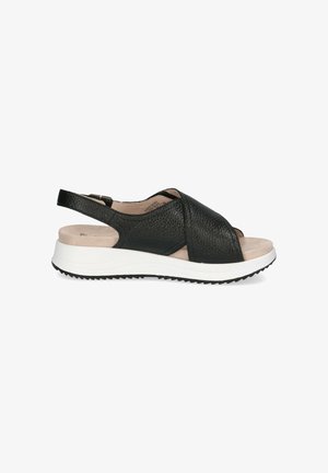 Sandale slingback en cuir noir avec dessus texturé, design à bout ouvert, semelle intérieure rembourrée et semelle en caoutchouc blanc dotée de rainures de traction.