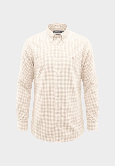 Dugih rukava košulja bež i bijele kockice s gumbima i ovratnikom s gumbima na dolje te malim uvezenim logotipom na lijevoj strani prsa.