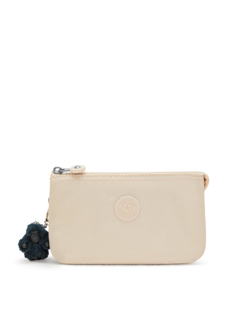 Beige nylon pouch with a zip closure, featuring a round logo and a dark blue furry keychain. Smooth texture with a rectangular shape.