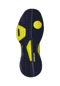 Suela de zapato de goma negra y amarilla con un patrón de banda de rodadura en espiga, superficie texturizada y un acento redondo amarillo con marca.