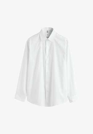 Valkoinen pitkähihainen puku- tai kauluspaita, jossa on terävä kaulus ja napilliset kalvosimet, edessä napitettu kiinnitys, esillä yksinkertaisella valkoisella taustalla.