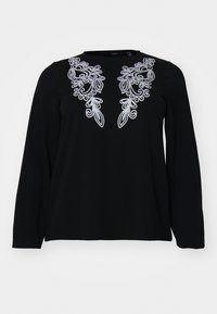 Black long-sleeve shirt with intricate silver embroidery around the neckline. Soft texture, relaxed fit, and simple crew neck design.