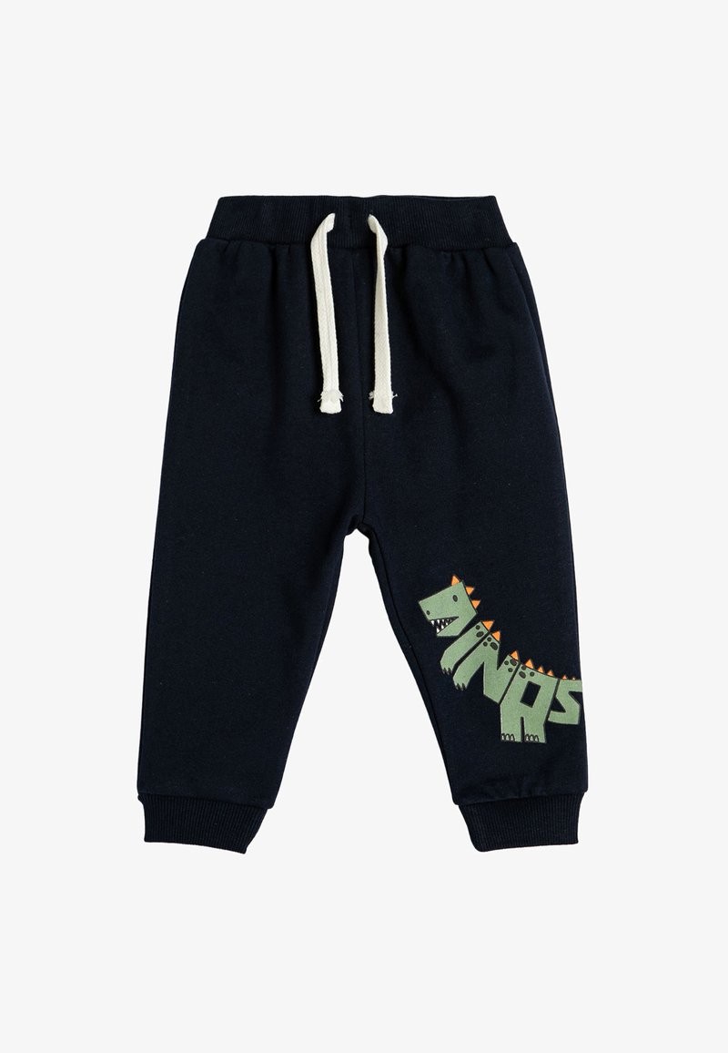 Marineblauwe sweatpants met elastische tailleband en crème kleurige trekkoord. Bevat een groene dinosaurustekening met oranje stekels en het woord "DINOS."