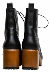 Black leather ankle boots with rounded toes, rear lacing, and chunky brown block heels. Smooth texture with minimal stitching detail.