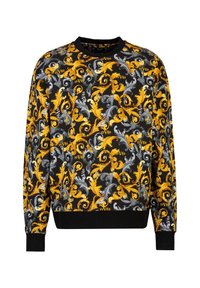 Langärmliger Pullover mit schwarzem Hintergrund, verz ornamentalen blauen, gelben und weißen blumigen Mustern sowie nummerischen Akzenten. Gerippte Bündchen und Kragen.