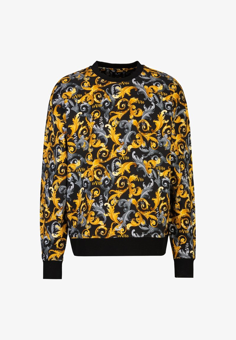 Langärmliger Pullover mit schwarzem Hintergrund, verz ornamentalen blauen, gelben und weißen blumigen Mustern sowie nummerischen Akzenten. Gerippte Bündchen und Kragen.