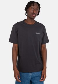 Black cotton t-shirt with a crew neck, featuring a small white "Element" logo on the chest. Short sleeves and standard fit.