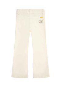 Jeans color crema con design affusolato, caratterizzati da una patch a forma di orso sulla tasca posteriore e una vita standard. Tessuto di alta qualità e liscio.