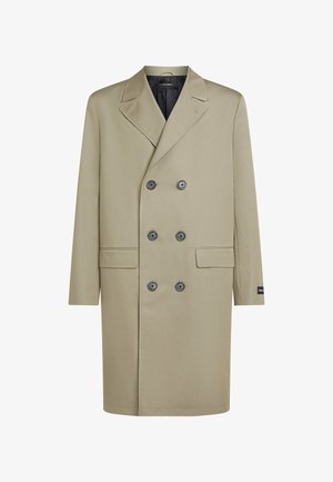 Helebeežikas kahekordse nööpimisega mantel, mis on valmistatud siledast kangast, mustade nuppude, kahe ees tasku ja sälguga kraega.