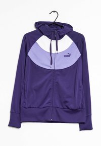 Sudadera morada con un acento blanco y lila claro. Cuenta con cremallera, capucha con cordón, puños acanalados y un pequeño logo de Puma en el pecho.