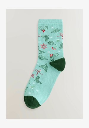 Grüne und minzfarbene Socken mit Mustern aus Stechpalme, Mistel und Bändern, mit einer dunkelgrünen Ferse und Spitze, hergestellt aus weichem Textilmaterial.