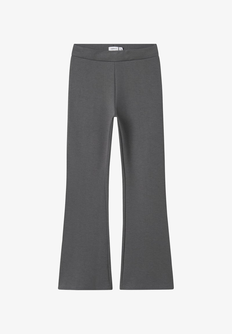 Grijze flared leggings van zacht, rekbaar materiaal. Heeft een brede, elastische tailleband en een naadloos ontwerp voor comfort en bewegingsgemak.