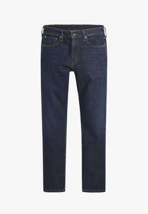 Mörkblå denimjeans med rak benhöjd, femfickdesign och metallknappslutning. Har kontrasterande sömmar överallt.
