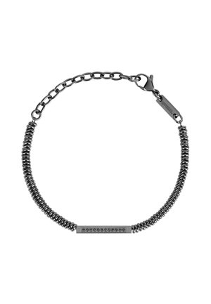 Czarny metalowy bransoletka z spiralnym odcinkiem i łańcuchowymi ogniwami. Posiada prostokątny amulet z siedmioma małymi czarnymi kamieniami. Zapięcie na karabińczyk.