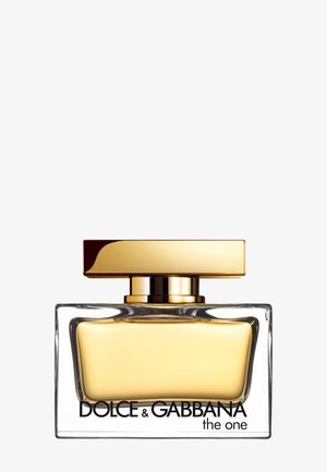 Flacon de parfum en verre transparent avec liquide doré et bouchon rectangulaire doré, étiqueté Dolce & Gabbana the One.