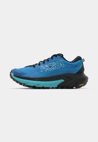 Zapatillas de correr azules con acentos negros, que cuentan con una parte superior texturizada, un cuello acolchado y una entresuela gruesa negra y turquesa con suela Vibram.