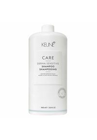 Bottiglia di plastica bianca di Keune Care Derma Sensitive Shampoo, 1000 mL, con un'etichetta piatta che mostra logo e dettagli del prodotto in testo nero e grigio.