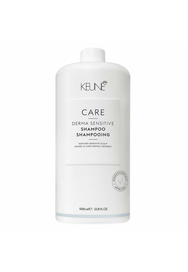 Bottiglia di plastica bianca di Keune Care Derma Sensitive Shampoo, 1000 mL, con un'etichetta piatta che mostra logo e dettagli del prodotto in testo nero e grigio.