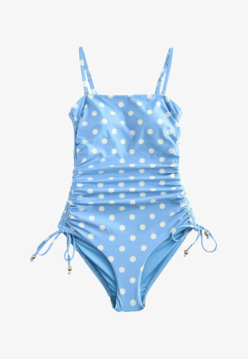 Maillot de bain une pièce bleu clair à pois blancs, bretelles ajustables, fronces sur les côtés et liens avec perles aux hanches.