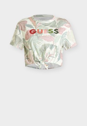 Short-sleeve cropped tie-front shirt with pastel tropical leaf print and "GUESS EST 1981" embroidered across the chest.