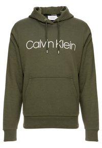 Felpa oversize verde oliva in cotone, con tasca a scomparsa davanti, cappuccio con coulisse e grande logo bianco "Calvin Klein" sul petto.