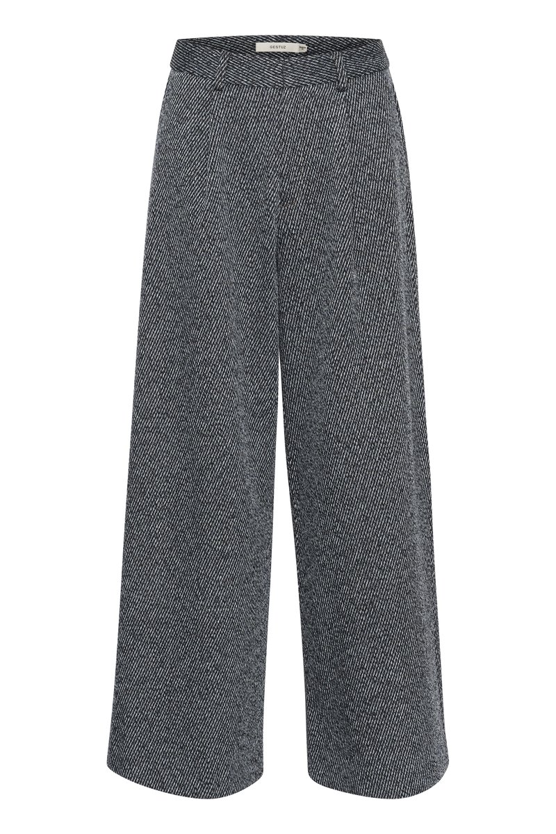 Pantaloni a gamba larga con un motivo a scacchi bianco e nero, caratterizzati da una vita liscia e un tessuto testurizzato per un tocco di profondità.