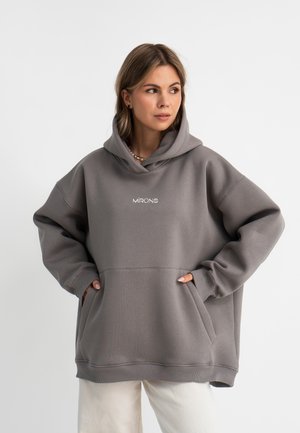 Grijze oversized hoodie met een voorzak en een capuchon met trekkoord. Voorzien van een geborduurd logo in het wit, geribbelde manchetten en een zachte textuur.