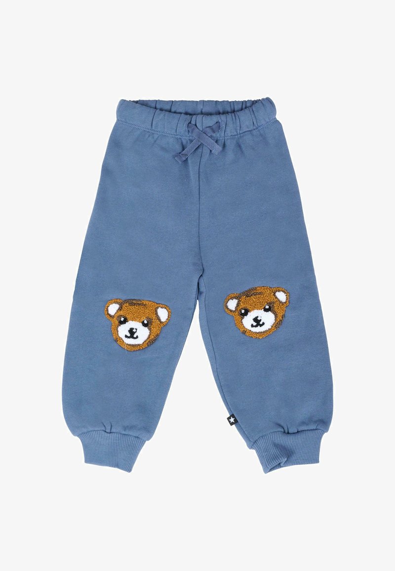 Blauwe sweatpants gemaakt van zacht materiaal, met aan beide knieën twee applicaties van een berengezicht en een trekkoord in de taille voor een verstelbare pasvorm.