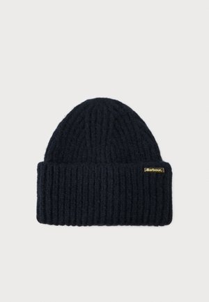 Knitted navy beanie hat with ribbed texture, featuring a folded brim and a gold logo tag on the side. Soft, warm wool material.