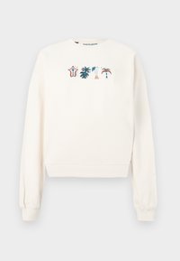 Sudadera color crema de material suave, con cuello redondo y mangas largas, con bordado colorido de temática tropical en el frente.