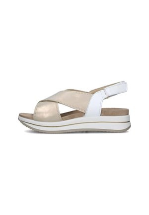 Sandali slingback beige e bianchi con design a fascia incrociata, soletta imbottita e suola piatta leggera con finitura testurizzata.