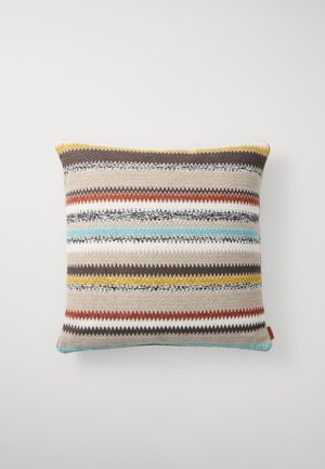 Textured rectangular pillow featuring zigzag stripes in beige, brown, orange, yellow, and blue. Made from woven fabric with a decorative edge.