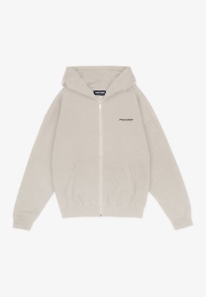 Haut à capuche zippé gris clair en tissu doux, avec une poche avant, une coupe décontractée et le logo "PEGADOR" en noir sur la poitrine gauche.