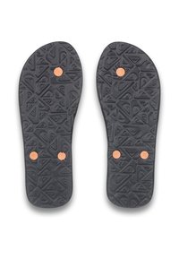 Semelles en caoutchouc noir avec un motif texturé et trois accents circulaires orange pour l'adhérence et le style.