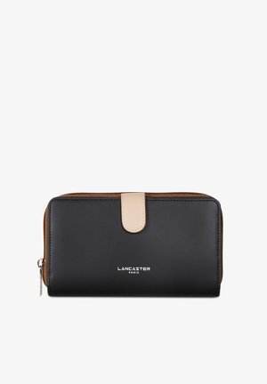 Black leather wallet with tan leather accents, zip closure, and gold-tone logo text "LANCASTER PARIS" on the front. Smooth texture.