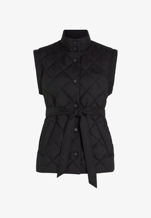 Svart, ermeløs quiltet vest med høy krage, toggleknepping, justerbart belte og sidelommer. Har diamantmønster på stoffet.