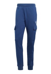 Mörkblå avsmalnande sweatpants med elastisk midja, sidofickor och Adidas-logotyp på höger lår.