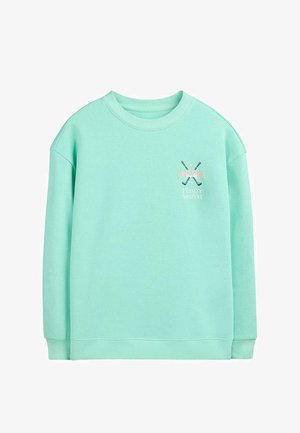 Sweat-shirt vert menthe à col rond avec des clubs de golf croisés et le texte "Golf Club Teddy Smith" sur le côté gauche de la poitrine.