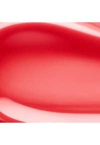 Liquide rouge lisse et brillant avec des reflets créant un effet de dégradé et des formes courbes douces à travers la surface.